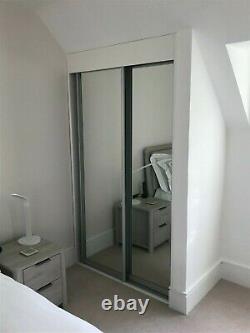 2 CLASSIC double wardrobes each with 2 sliding mirrored doors -one year old