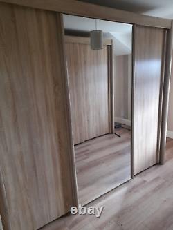2 Large wardrobes mirrored 3 sliding doors 1 double 1 triple FREE STANDING