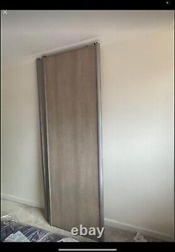 3 X Valla Grey Oak B&Q wardrobe sliding doors. 2 plain, 1 with mirror