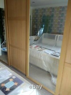 Complete mirror and light oak sliding wardrobe doors used