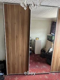 Contemporary sliding door wardrobe, Nolte, 3large doors, 1 mirror, walnut effect
