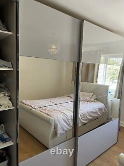Large grey mirrored wardrobe with sliding doors, purchased from Bensons and Beds