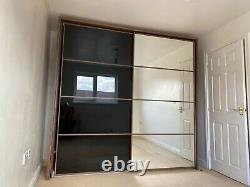 Modern Large Sliding Door double Wardrobe. Mirror/black Buyer to Dismantle